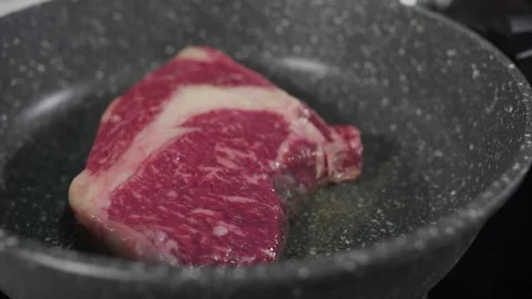 Steak in a frying pan Video stock 268577651