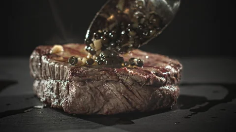 Steak with Green Pepper Sauce Stock Footage 135644871