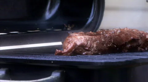 Steak on the grill 2 CU HD released Stock Footage 352929