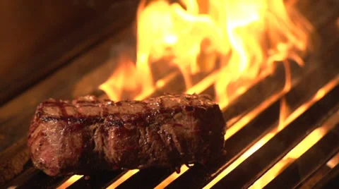Steak On Grill Fire - Slow Motion Stock Footage