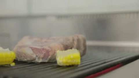 Steak grilled with corn Video stock 81422881