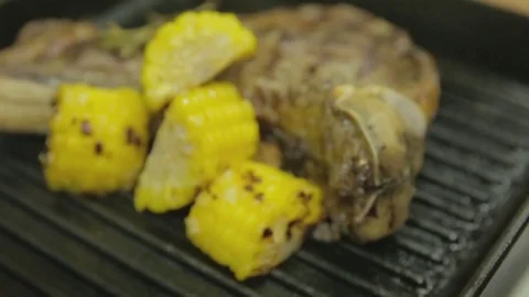 Steak grilled with corn Video stock 83293802