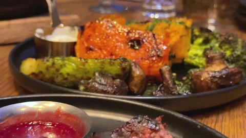 Steak grilled vegetables Snacks with meat, sausage, French fries, crackling and Stock Footage 323923428