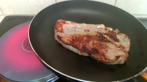 A steak on the hot plate Stock Photos