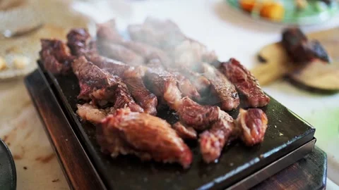 Steak on hot stone cooking. Stock Footage 204809732
