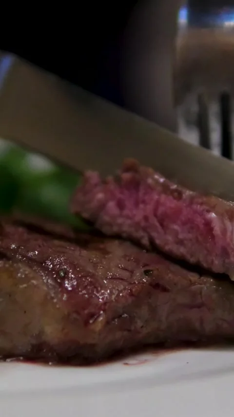 Steak knife cutting Steak with BBQ Meat and Roasted Beef Food Rosemary Sirloin Stock Footage 302822223
