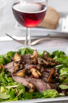 Steak on lamb's lettuce Stock Photos