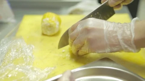 The steak lies on the table, the cook cut corn into pieces Stock Footage 81392030