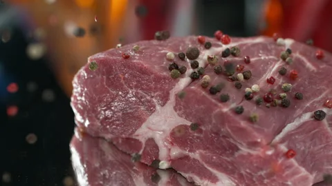 Steak meat. Closeup of pork meat falling salt and papper. 4k Stock Footage 131742470