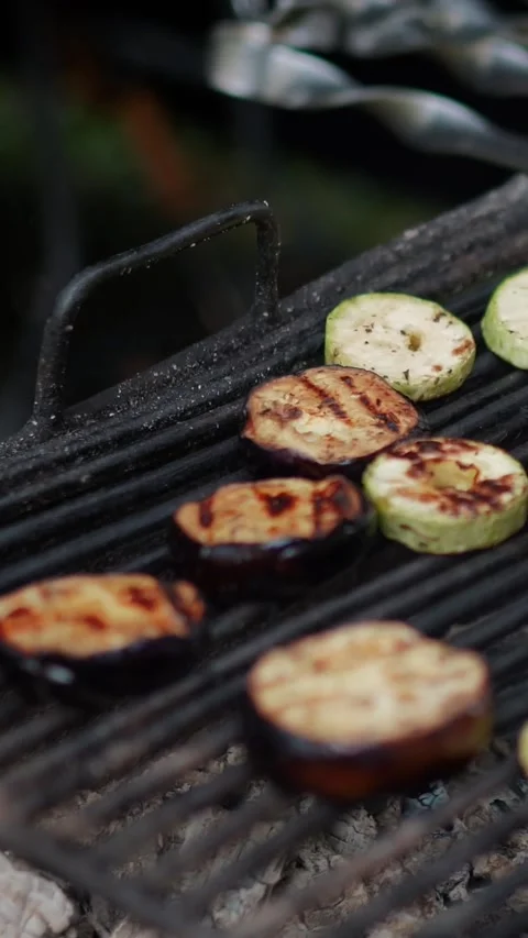 Steak meat is fried on fire and smoke. Barbecue grill with smoke on coals Stock Footage 322790832