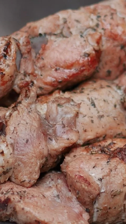 Steak meat is fried on fire and smoke. Barbecue grill with smoke on coals Stock Footage 322790939