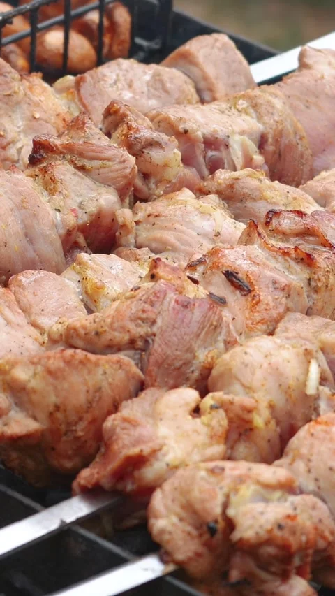 Steak meat is fried outside on fire and smoke. Barbecue grill with smoke Stock Footage 304807019