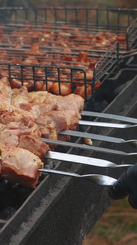 Steak meat is fried outside on fire and smoke. Barbecue grill with smoke Stock Footage 304807106