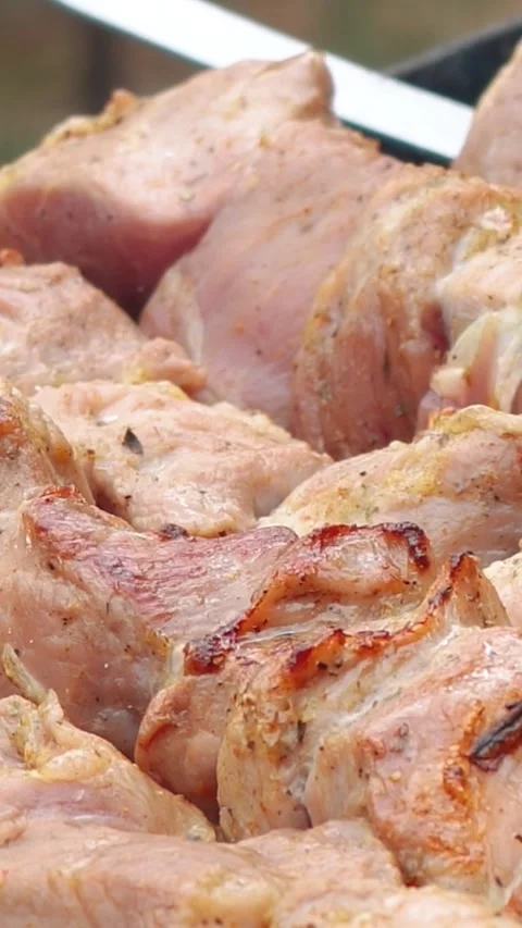 Steak meat is fried outside on fire and smoke. Barbecue grill with smoke Stock Footage 304807286