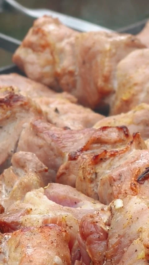Steak meat is fried outside on fire and smoke. Barbecue grill with smoke Stock Footage 304807297