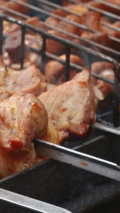 Steak meat is fried outside on fire and smoke. Barbecue grill with smoke Stock Footage 304807328