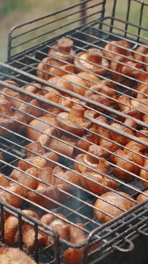 Steak meat is fried outside on fire and smoke. Barbecue grill with smoke Stock Footage 304807816