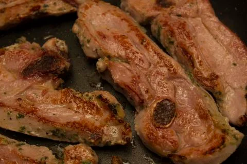 Steak meat grilled on pan Stock Photos