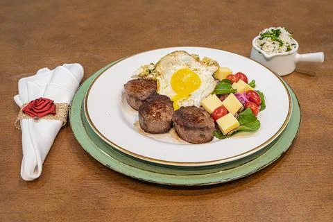 Steak medallions with fried egg studio food photography Stock Photos