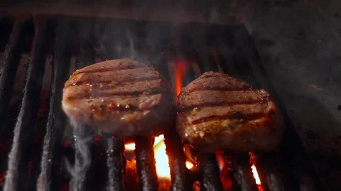 A steak over an open fire on a grill Stock Footage 70232053