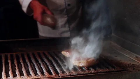A steak over an open fire on a grill Stock Footage 70232253