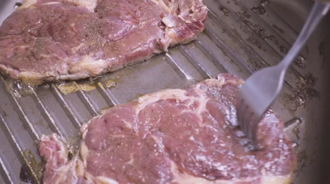 Steak on pan Stock Footage 55690213