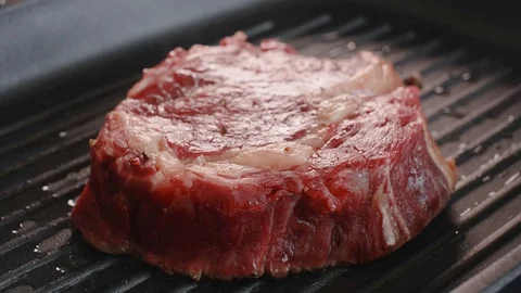 Steak  in a pan Stock Footage 107587140