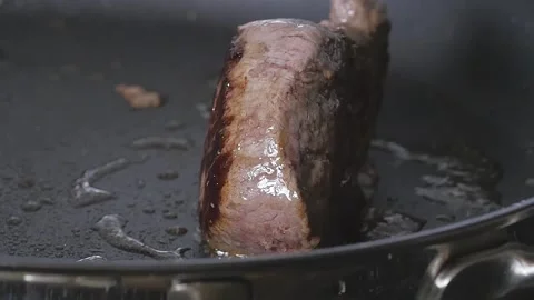 Steak in Pan Frying Stock Footage 169611457