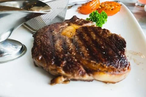 Steak in plate Stock Photos