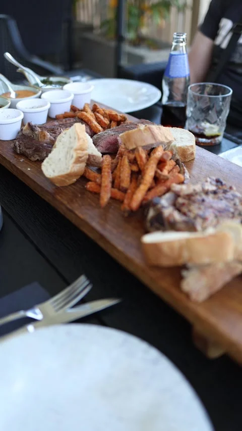 Steak platter restaurant dinner Stock Footage 334521173