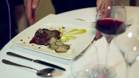Steak with Potatoes is served in the Restaurant Video stock 263344981
