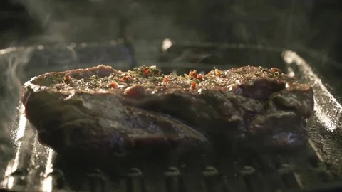Steak professional cooking on grill by chef in restaurant Stock Footage 71617543