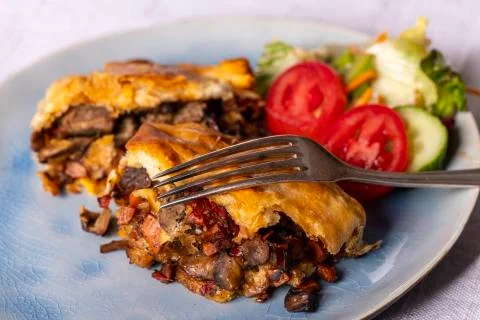 Steak in puff pastry Stock Photos