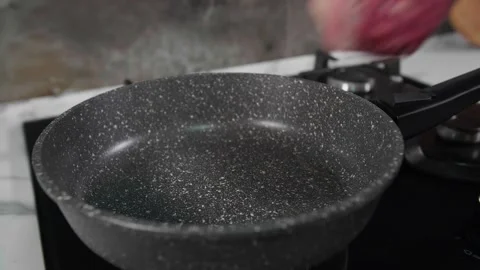 The steak is put in a frying pan Stock Footage 268577667