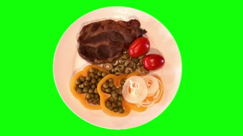 Steak with raw vegetables on plate, top shot Stock Footage 47546979