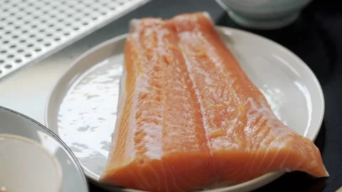 A steak of red salmon on a plate Stock Footage 205590789