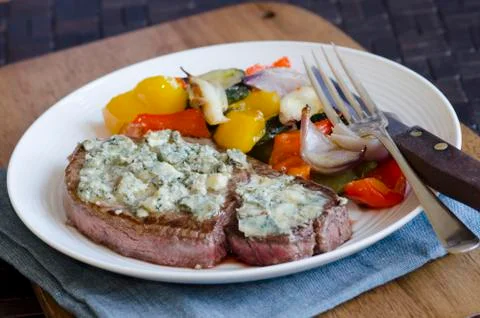 Steak with roast vegetables Stock Photos