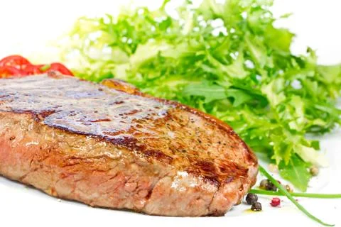 Steak with salad Stock Photos
