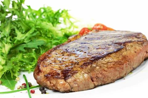 Steak with salad Stock Photos
