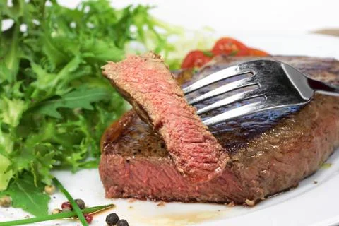 Steak with salad Stock Photos