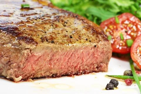 Steak with salad Stock Photos
