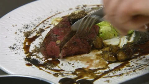 Steak served with brussels sprout Stock-Footage 87765181