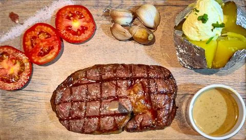 Steak set serve with side dish in restuarant. Stock Photos