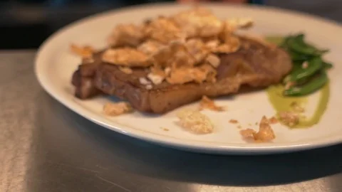 Steak with tapioca fries and peas served in kitchen Stock-Footage 72276162