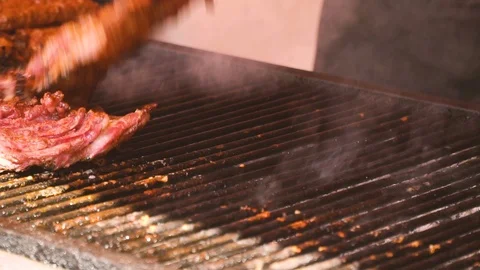 Steak turned on grill Stock Footage 96161011