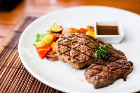 Steak with vegetables Stock Photos
