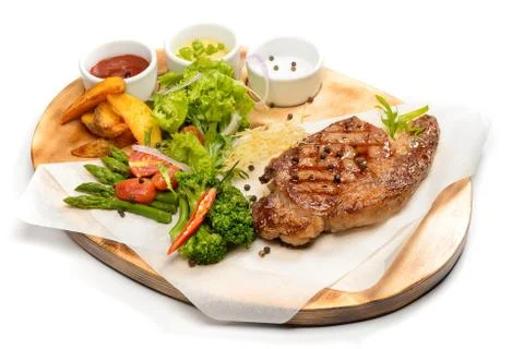 Steak with vegetables Stock Photos