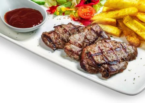 Steak with vegetables Stock Photos