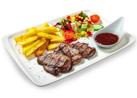 Steak with vegetables Stock Photos