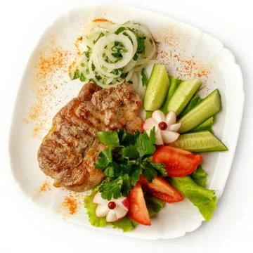 Steak with vegetables on a white background Foto stock